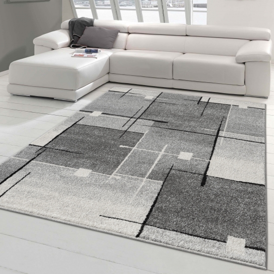 Moderner Wohnzimmerteppich mit abstrakten Quadraten schwarz grau