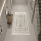 Preview: Teppich Creme mit floraler Ornamentik, Fransen und modernem Design