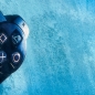 Preview: Gaming Teppich mit Joystick und blauem Neon-Strahl