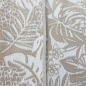 Preview: Recyclebarer Outdoor-Teppich mit tropischem Flair in beige