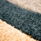 Preview: Pflegeleichter Teppich mit Wellenoptik in schwarz-braun