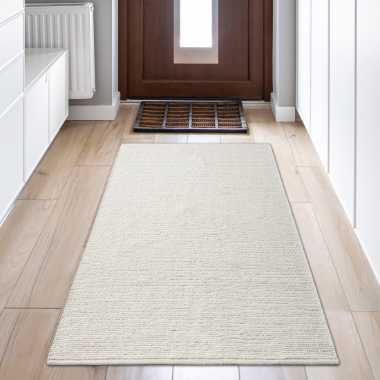 Elegant handgewobener Wollteppich in creme