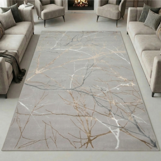 Designer Teppich mit abstraktem Ästemuster in gold