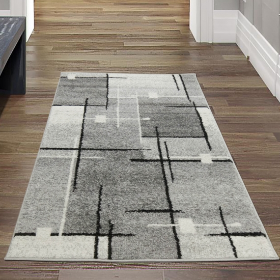 Moderner Wohnzimmerteppich mit abstrakten Quadraten schwarz grau