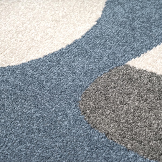 Preview: Kinderteppich in Blau mit fröhlichem Monster