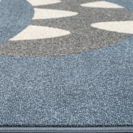 Kinderteppich in Blau mit fröhlichem Monster