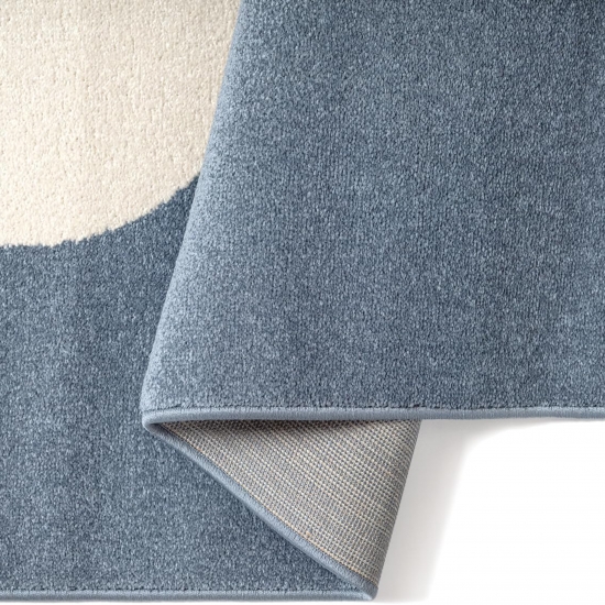 Kinderteppich in Blau mit fröhlichem Monster