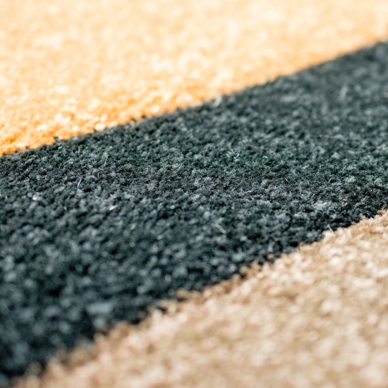 Pflegeleichter Teppich mit Wellenoptik in schwarz-braun