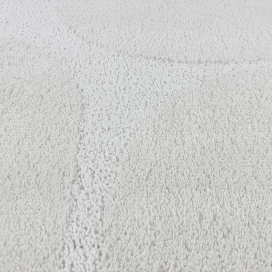 Moderner Hochflor Teppich mit organischem Muster in Creme