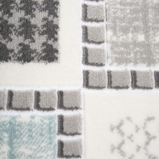 Moderner Kurzflorteppich mit grafischem Patch-Design Grau mit dezenten Farbakzenten