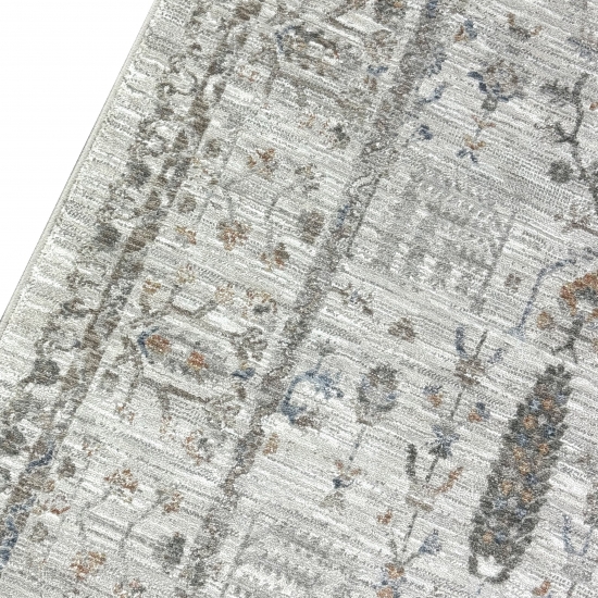 Teppich Creme mit floraler Ornamentik, Fransen und modernem Design
