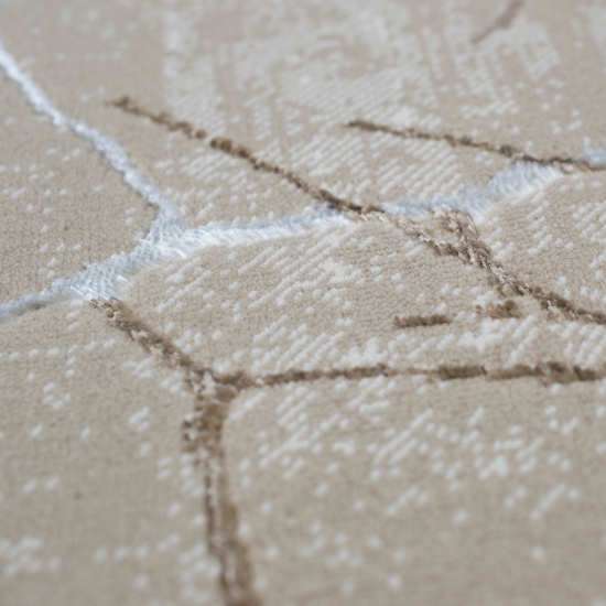 Designer Teppich mit abstraktem glänzenden Ästemuster beige