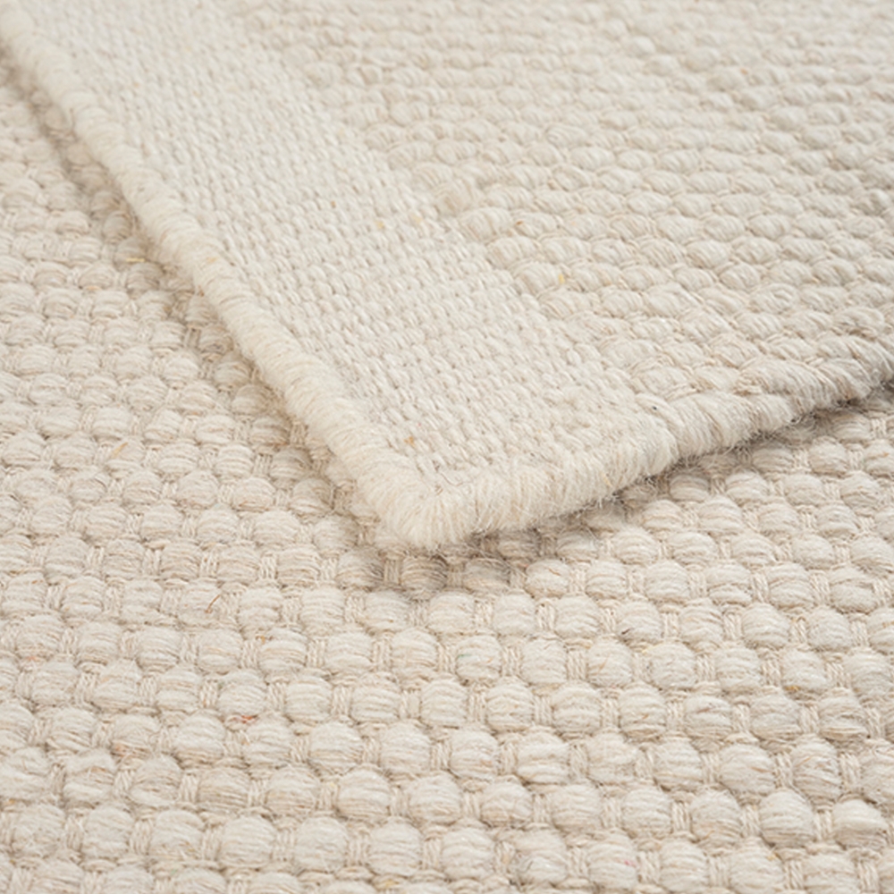 Handgewebter Wollteppich in Creme - luxuriös und pflegeleicht