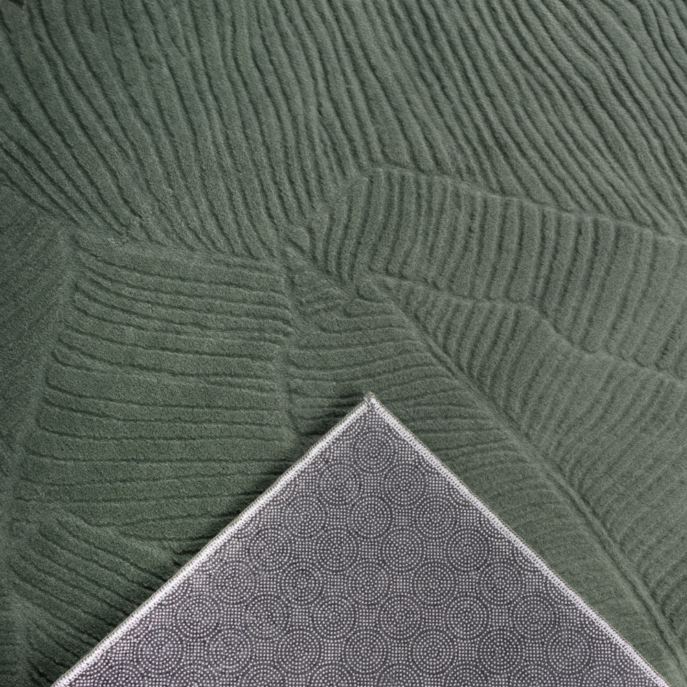 Kuschliger Teppich mit schönem Blättermuster in grün
