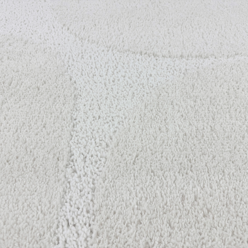 Moderner Hochflor Teppich mit organischem Muster in Creme