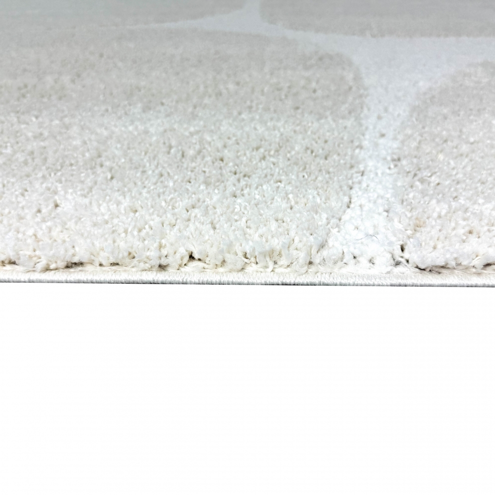 Moderner Hochflor Teppich mit organischem Muster in Creme