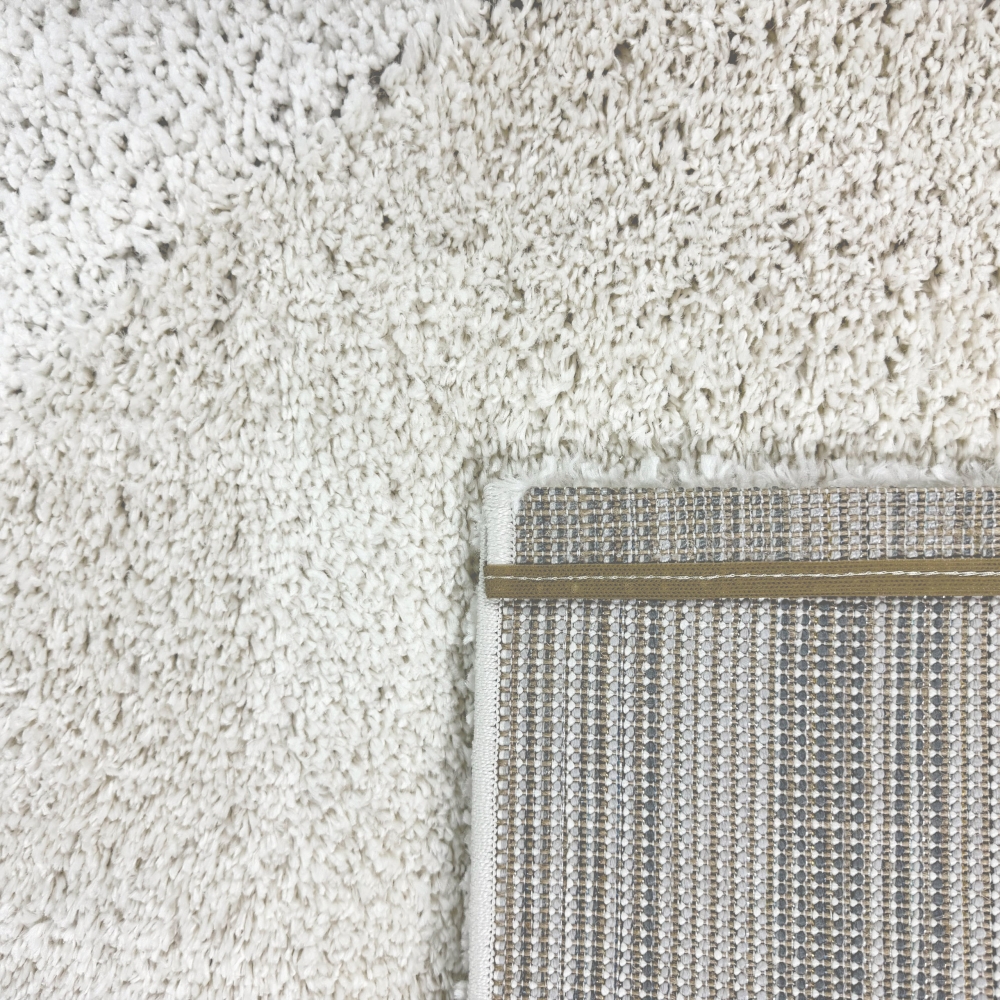 Moderner Hochflor Teppich mit organischem Muster in Creme