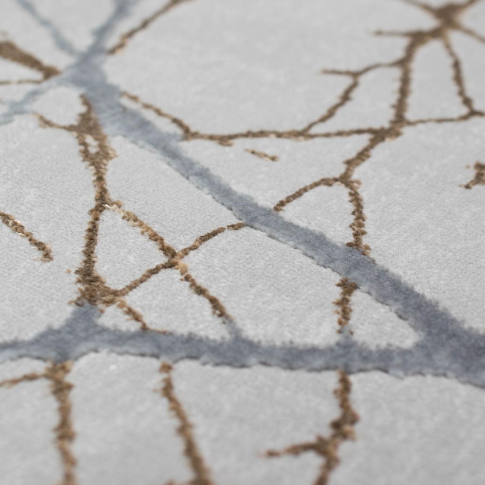 Designer Teppich mit abstraktem glänzenden Ästemuster gold