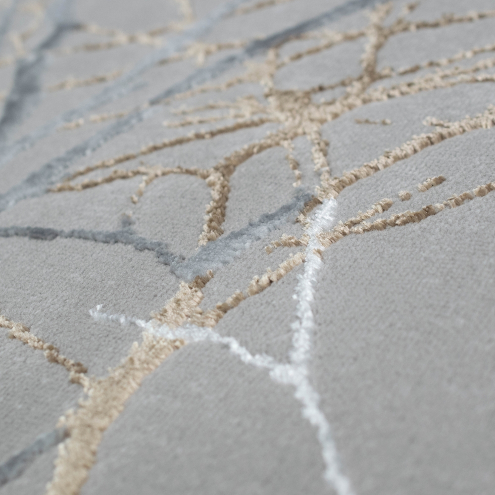 Designer Teppich mit abstraktem glänzenden Ästemuster gold